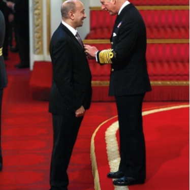 Ayub Khan being awarded an MBE by Prince Charles | Image courtesy of Ayub Khan