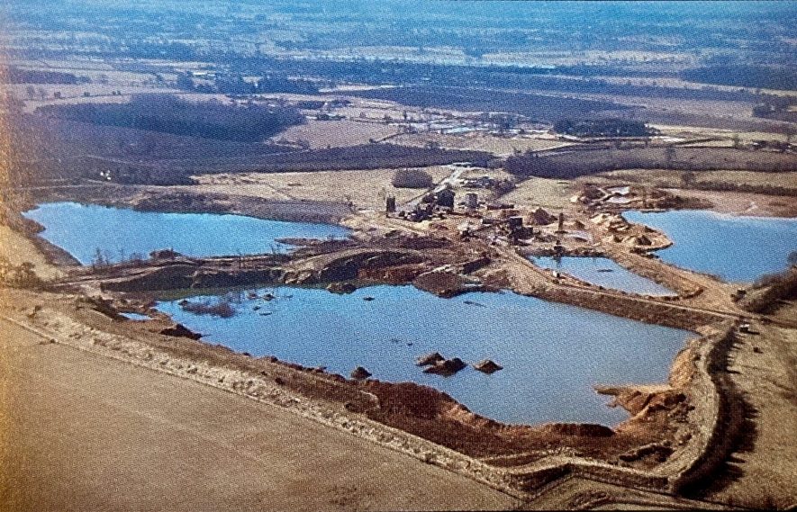Photograph of former sand and gravel pits filled with water in local landscape | Records deposited by the National Coal Board at Warwickshire County Record Office, reference CR3418-403